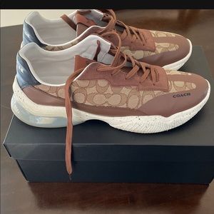 Coach Citysole runners. dark khaki and a cream color and the size is 11.5d.